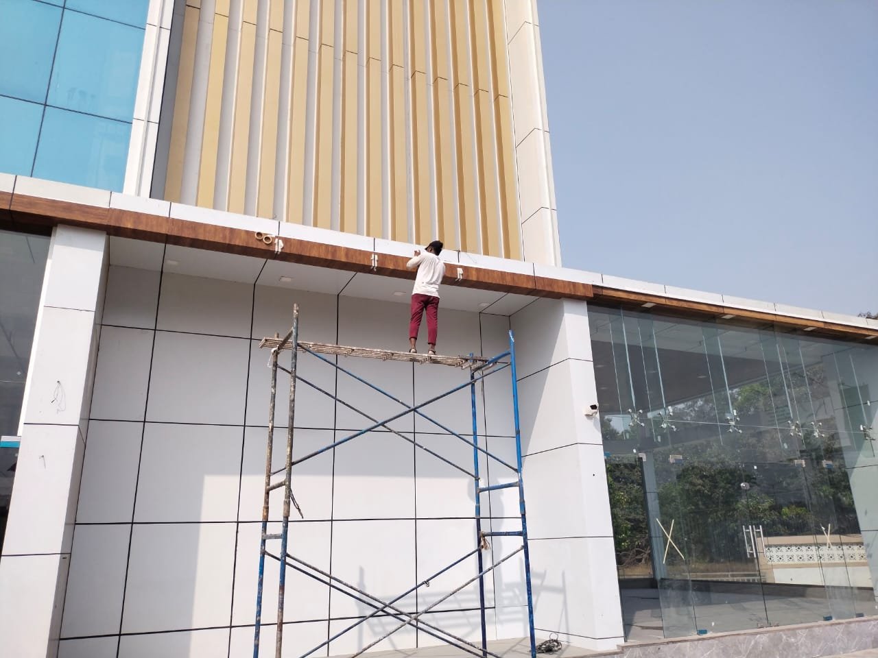 ACP cladding installation in progress - site team at work